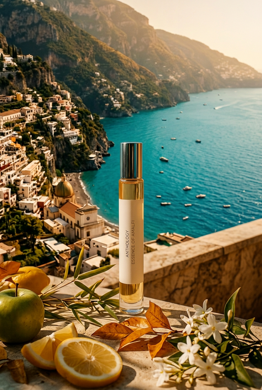 Person holding a perfume bottle by the beach